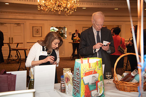 Perusing the Silent Action Items at the Partners for Women and Justice’s Annual Celebrate Hope Spring Benefit, 2019.
