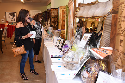 Taste of Italy guests perusing the Silent Auction items